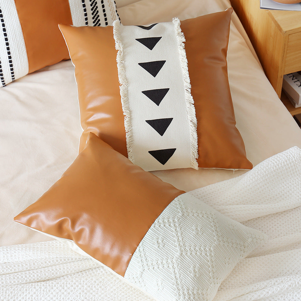 Decorative cushion cover made of faux leather with woven ethnic stripe