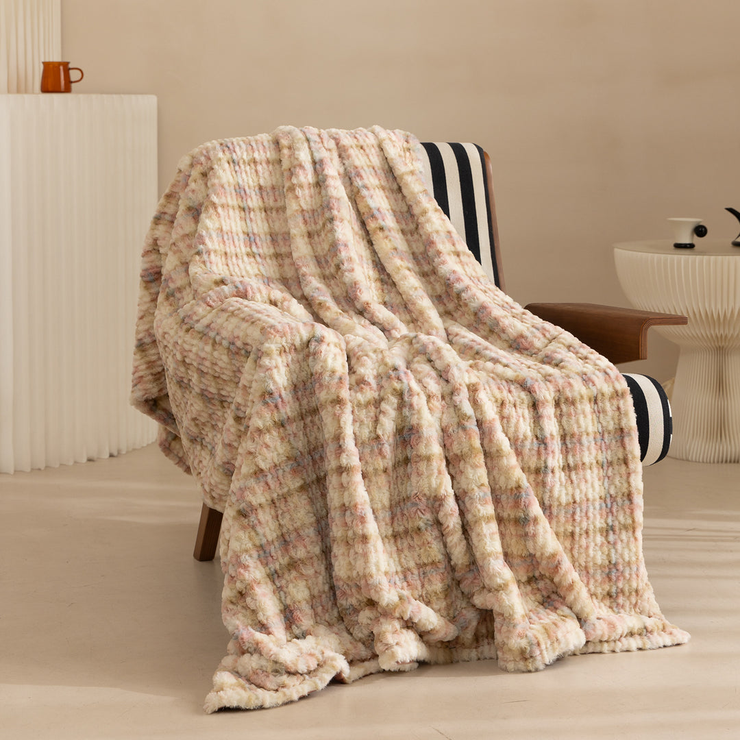 Cozy blanket made of luxurious synthetic fur with wavy texture and soft microfiber back