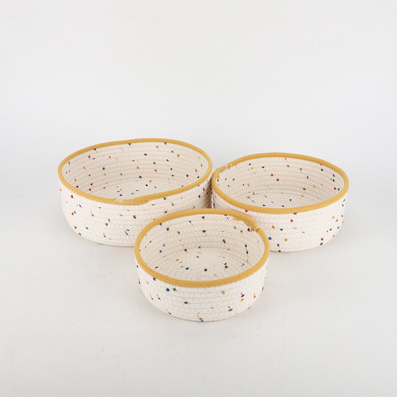 Storage basket made of natural cotton fabric with colorful dots