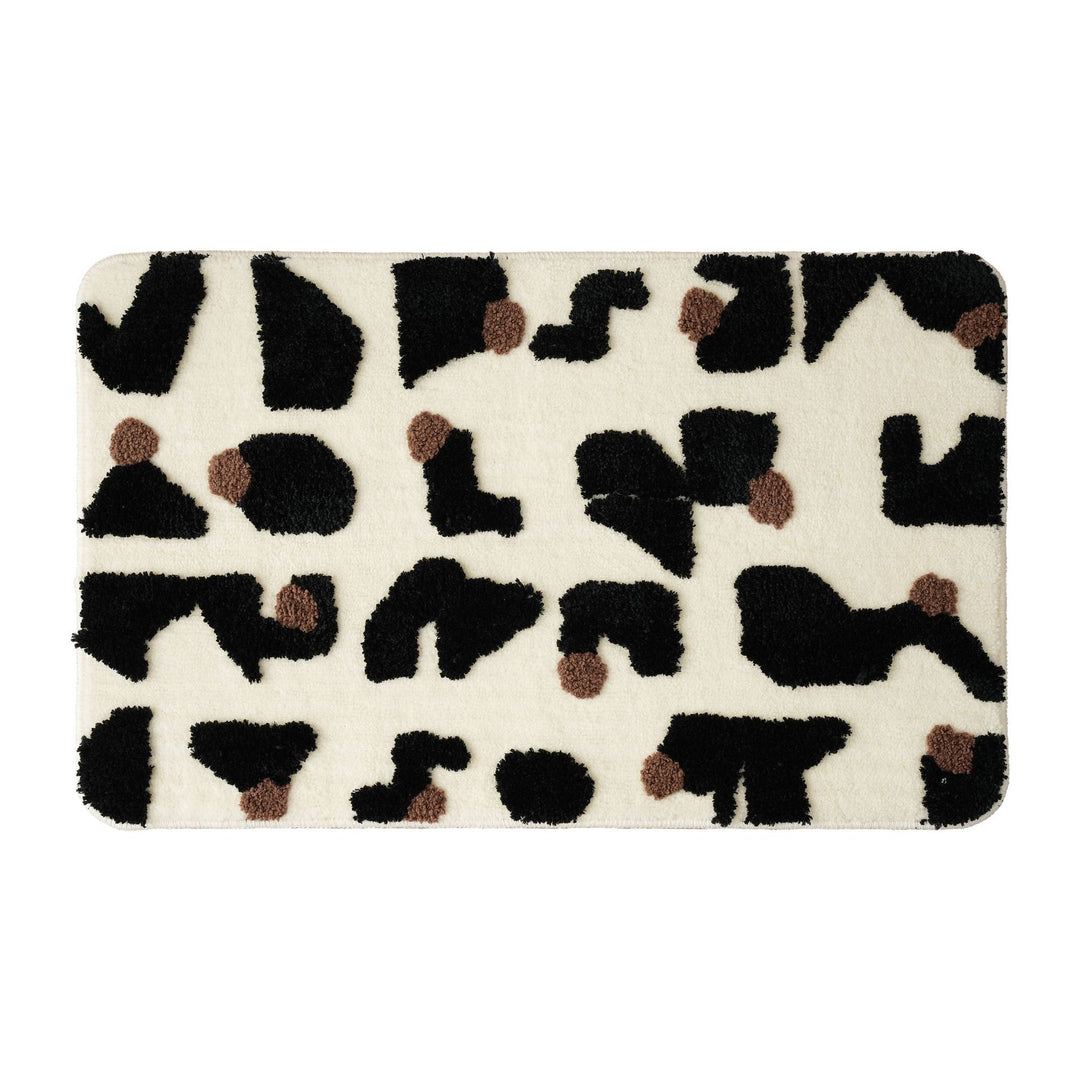 Tufted bathroom mat in abstract leopard pattern with soft high pile