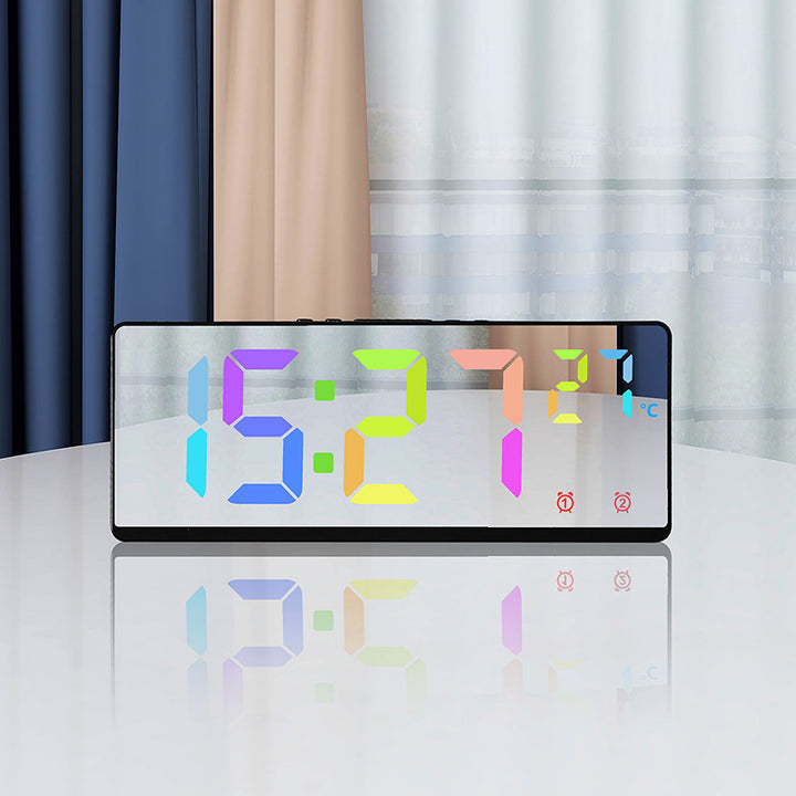 Digital alarm clock with temperature sensor and mirror function