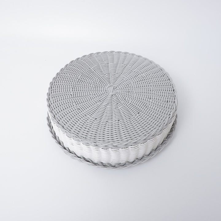 Handwoven storage basket with decorative edge