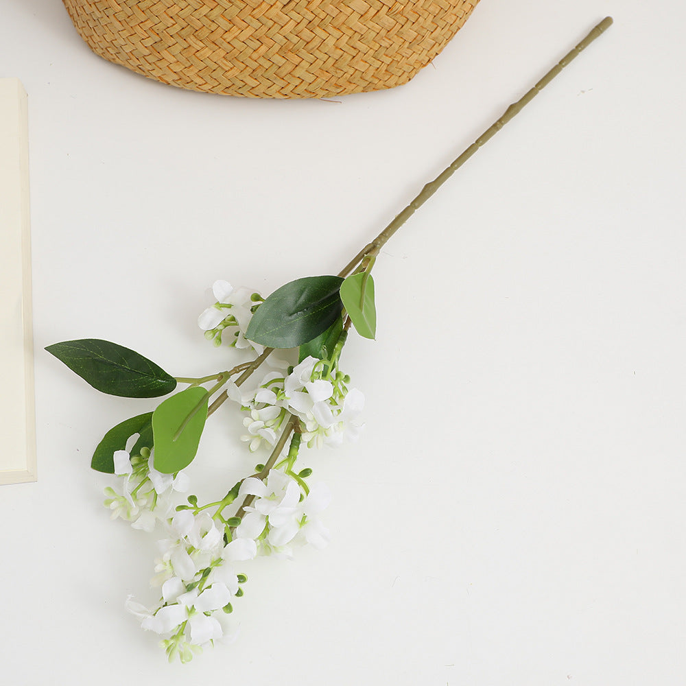 Artificial flower branch with bright flowers