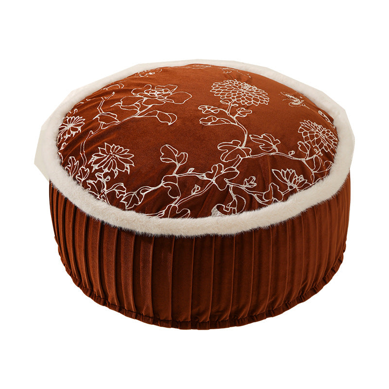 Round velvet floor pouf with floral embroidered top and faux fur trim