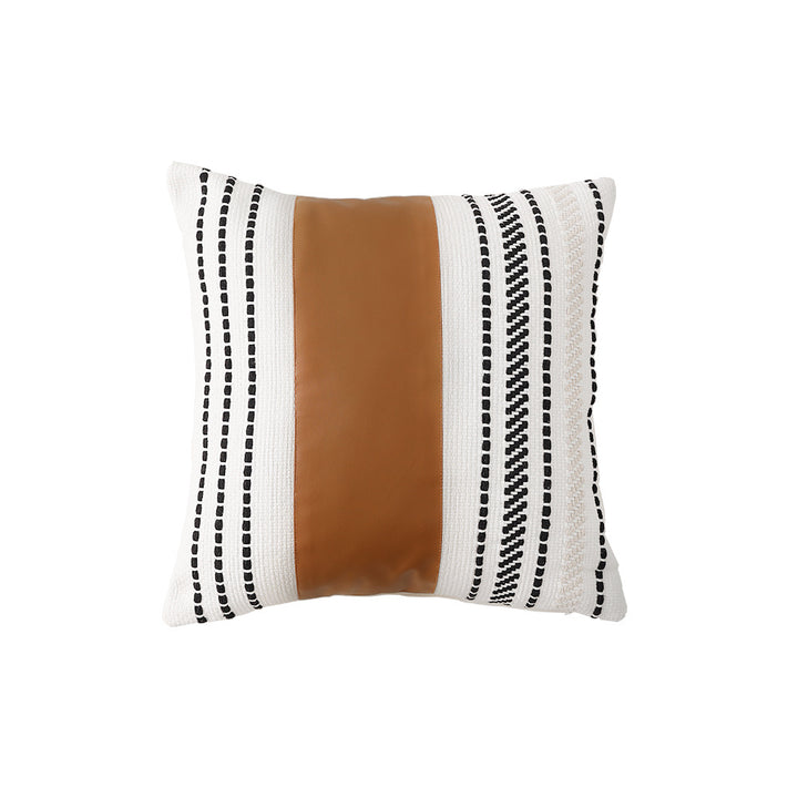 Decorative cushion cover made of faux leather with woven ethnic stripe