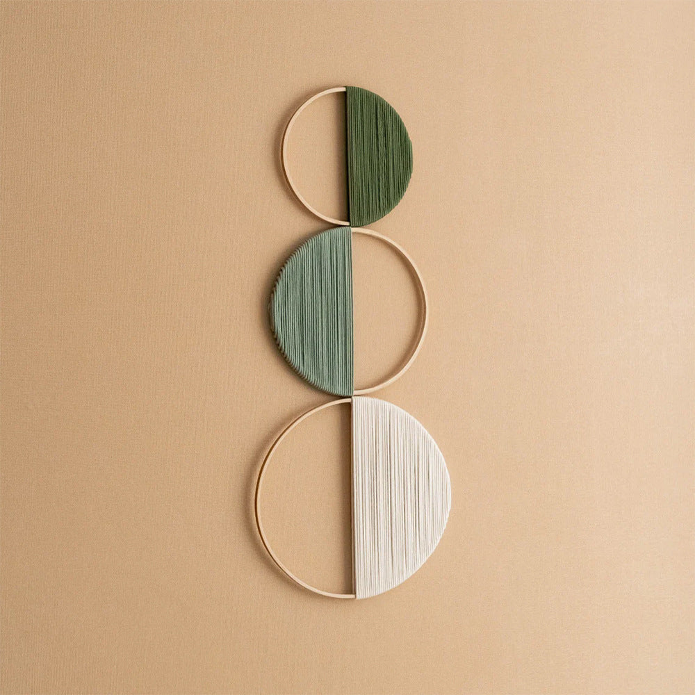 Modern wall art piece made of macrame and wood