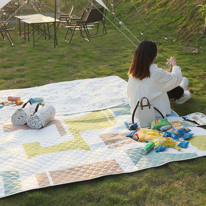 Quilted bedspread with large floral appliqué and diamond quilted relief