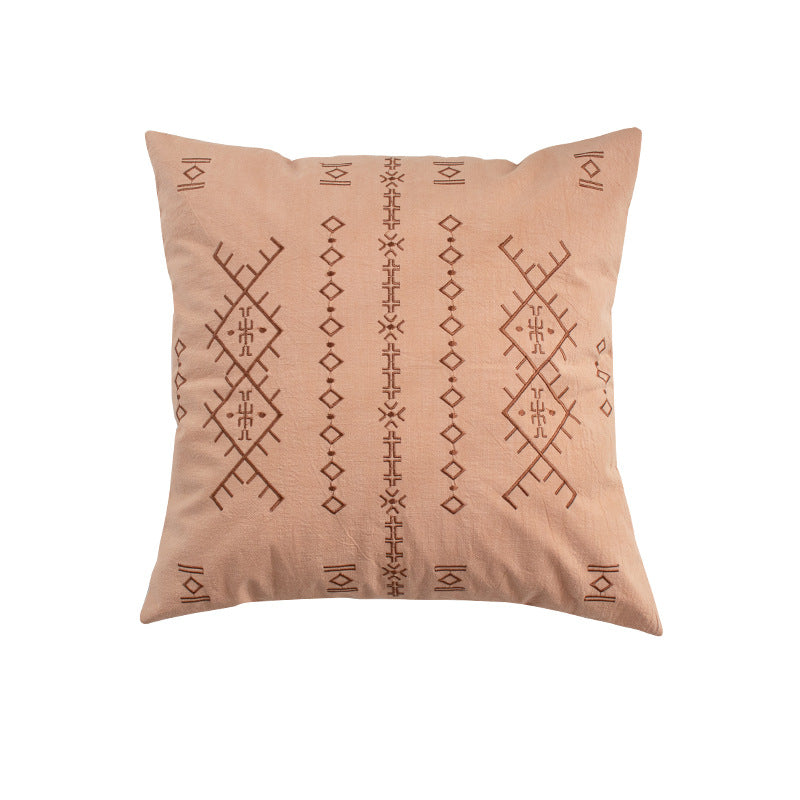 Square decorative cushion with fine relief embroidery in ethnic design and removable cover