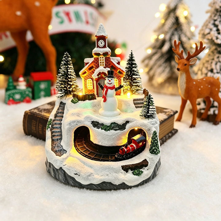 Illuminated Christmas village decoration with moving figures