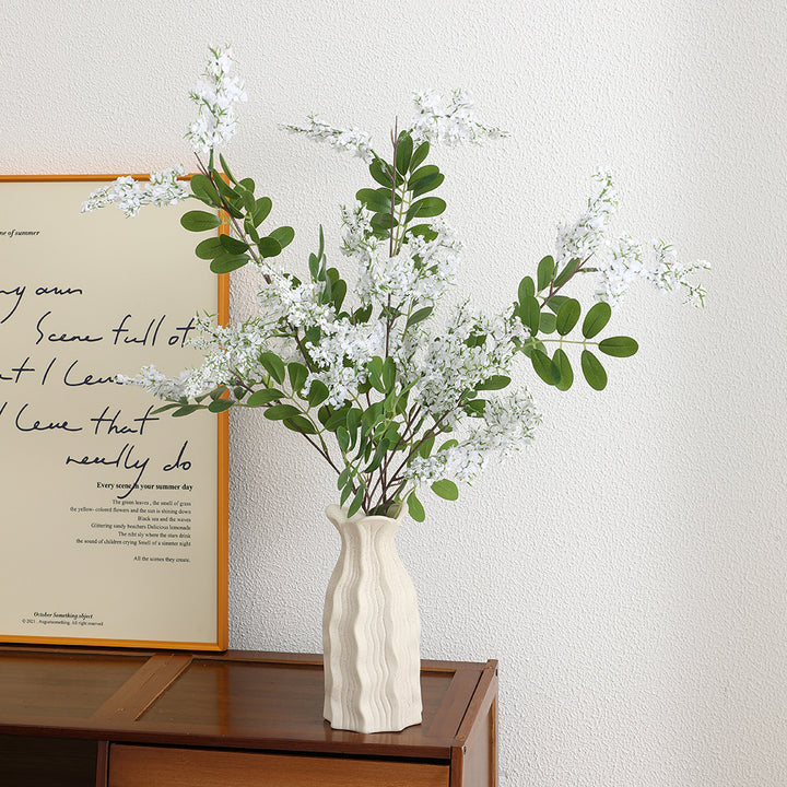 Artificial flower branch with vibrant purple flowers