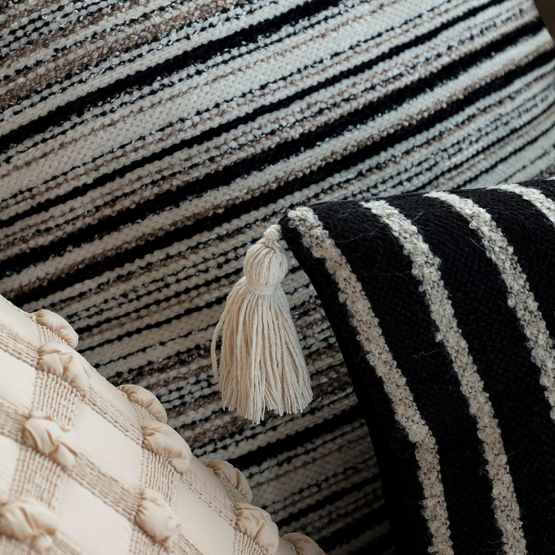 Woven home decor pillow cover with fine striped texture and hand-fringed edge