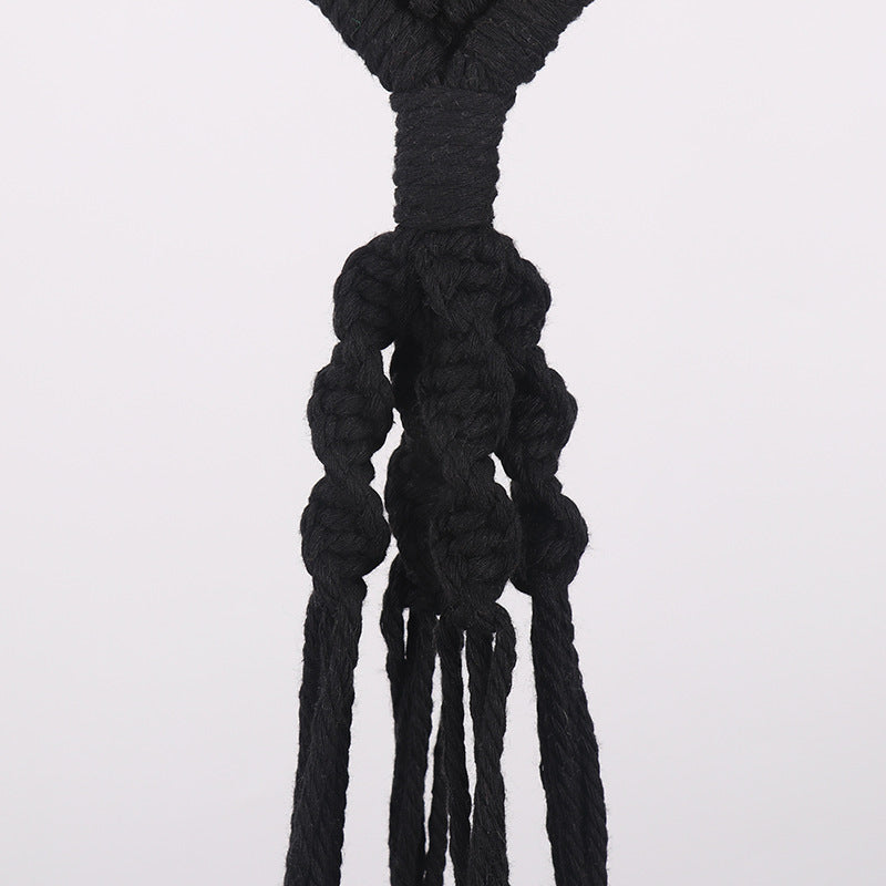 Macrame plant hanger with decorative design