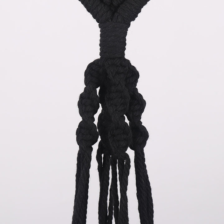 Macrame plant hanger with decorative design