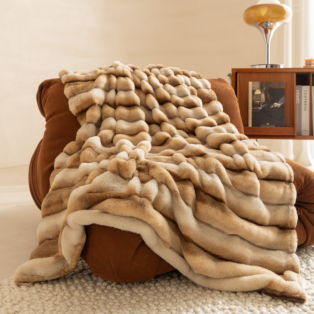 Luxurious cozy faux fur blanket with quilted relief pattern