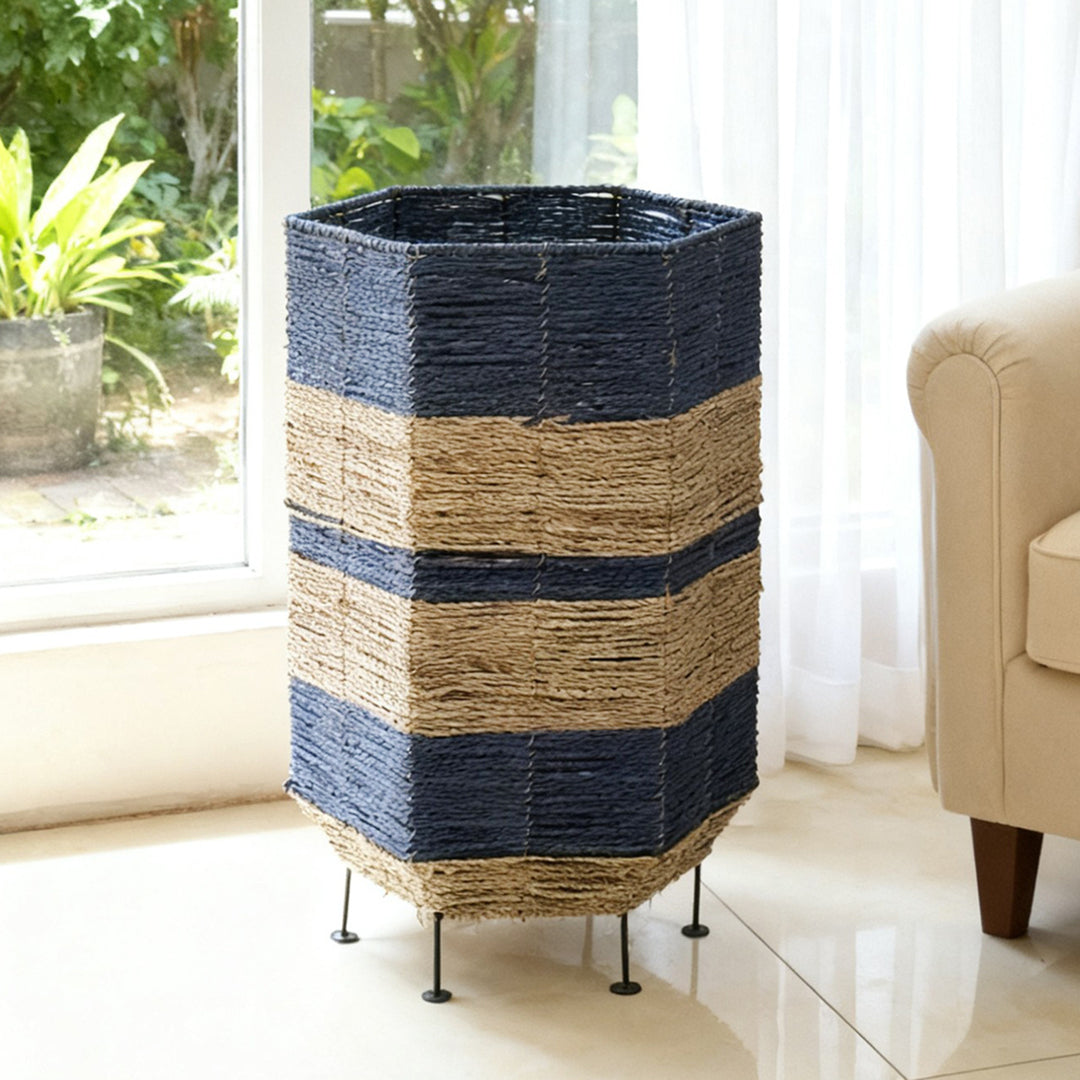 Stylish laundry basket made of rattan with metal legs