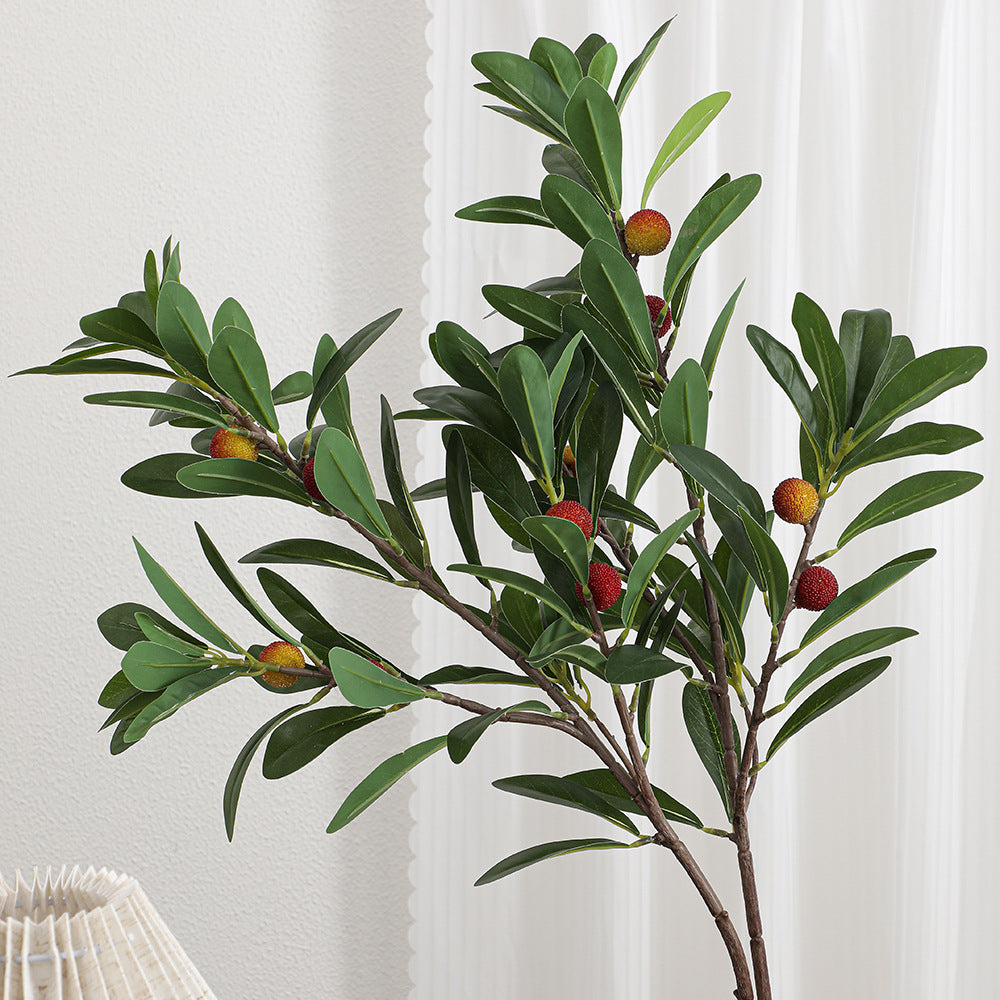 Artificial branch with decorative fruits