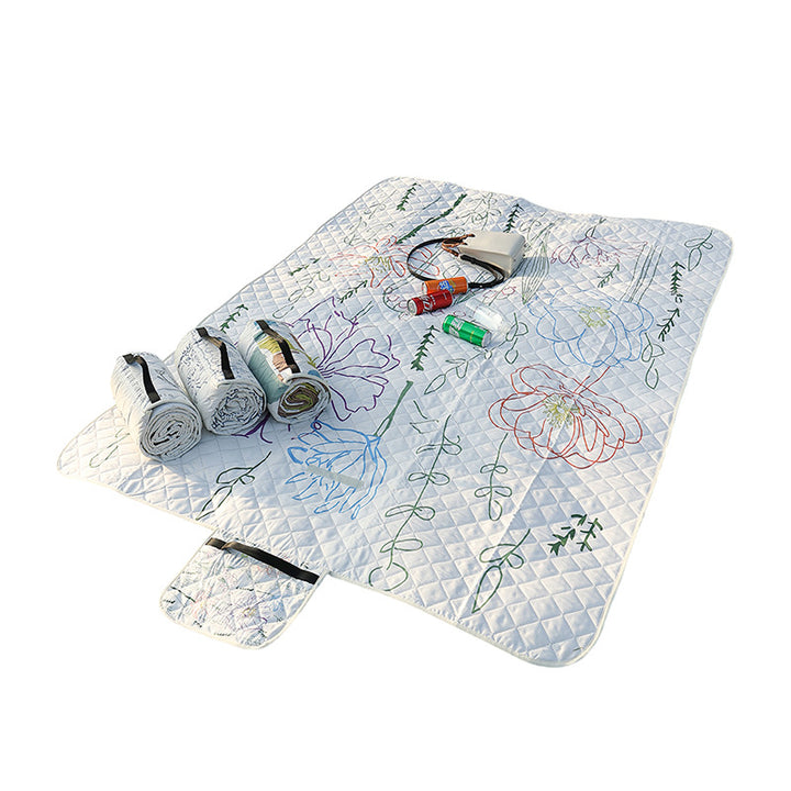 Quilted bedspread with large floral appliqué and diamond quilted relief