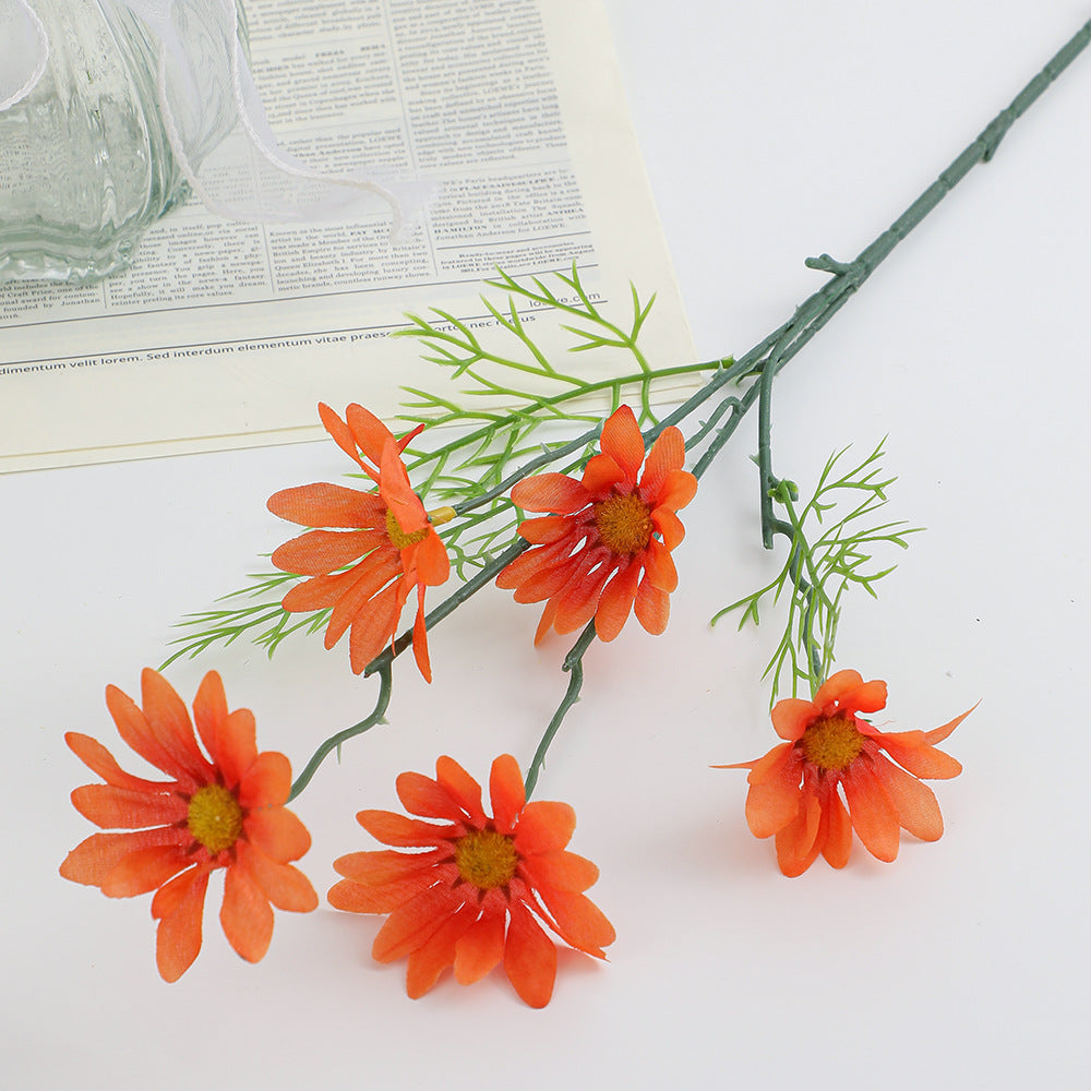 Artificial flower branch with bright blooms and delicate leaves