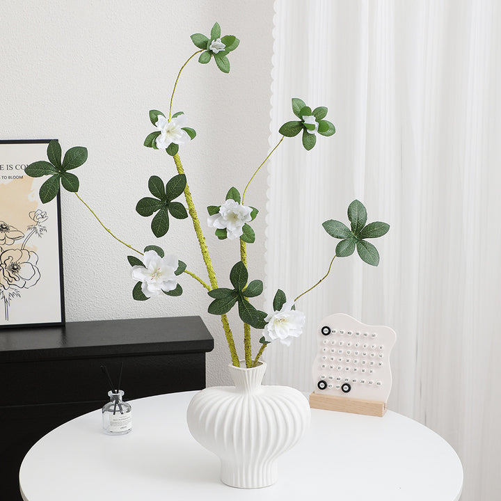 More elegant artificial flower branch with realistic blooms and leaves