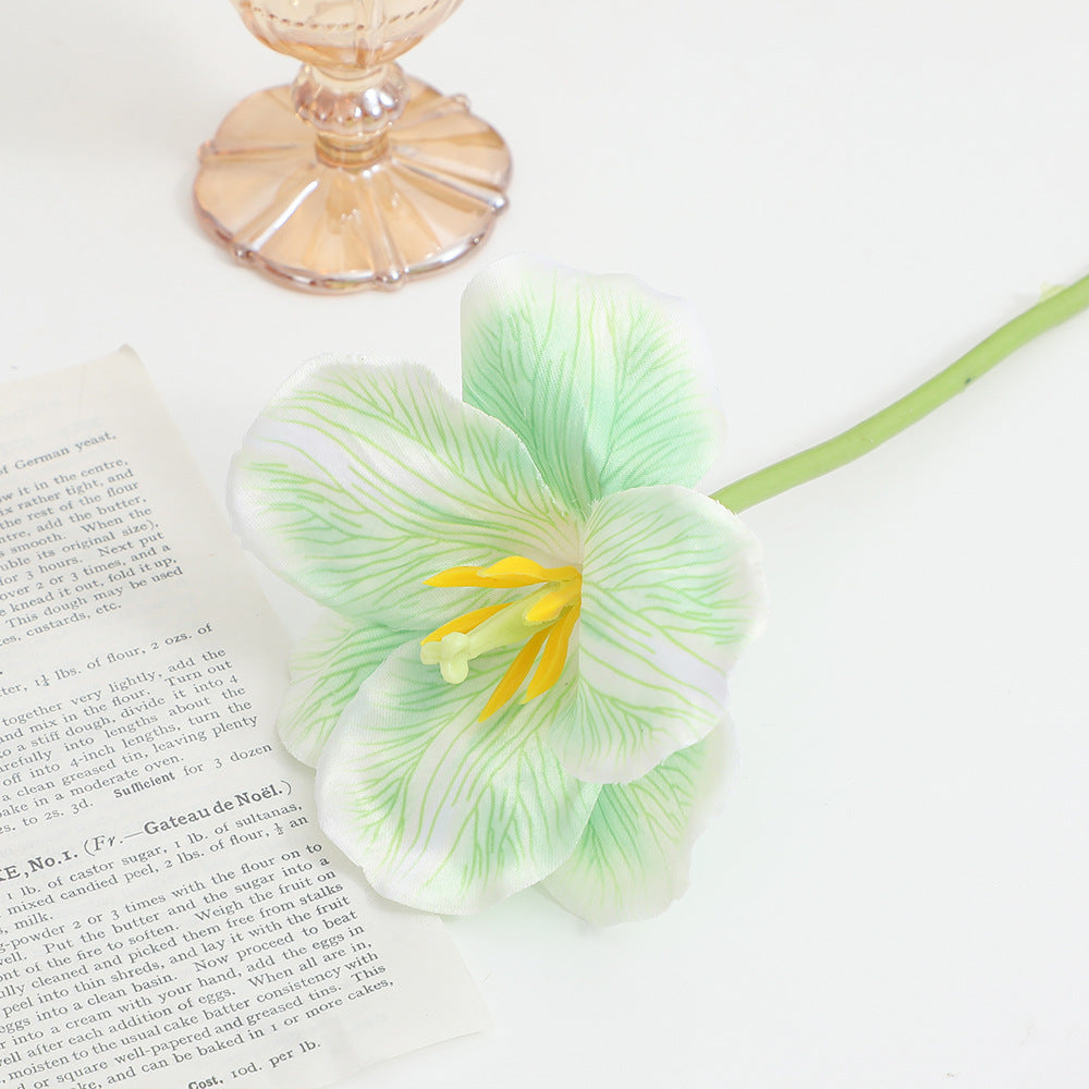 Artificial orchid flower branch with intricately detailed flowers