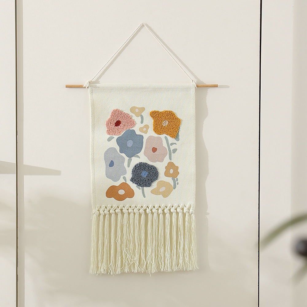 Woven cotton wall hanging with punch needle flower relief and fringes