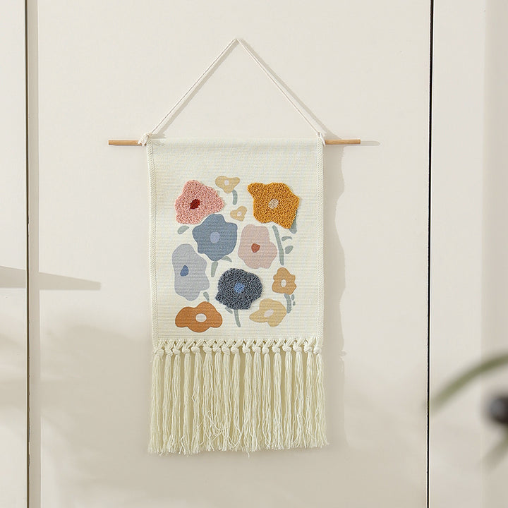 Woven cotton wall hanging with punch needle flower relief and fringes