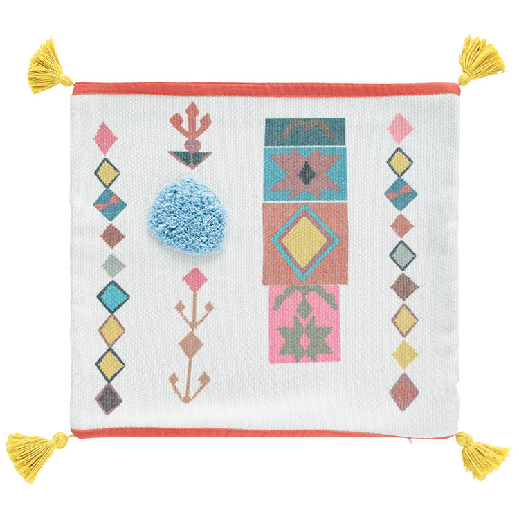 Square Boho decorative pillow with crocheted pom-pom and decorative corner tassels