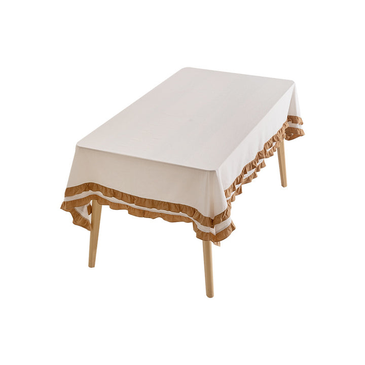 Round tablecloth with quilted textured relief and double-layered ruffle