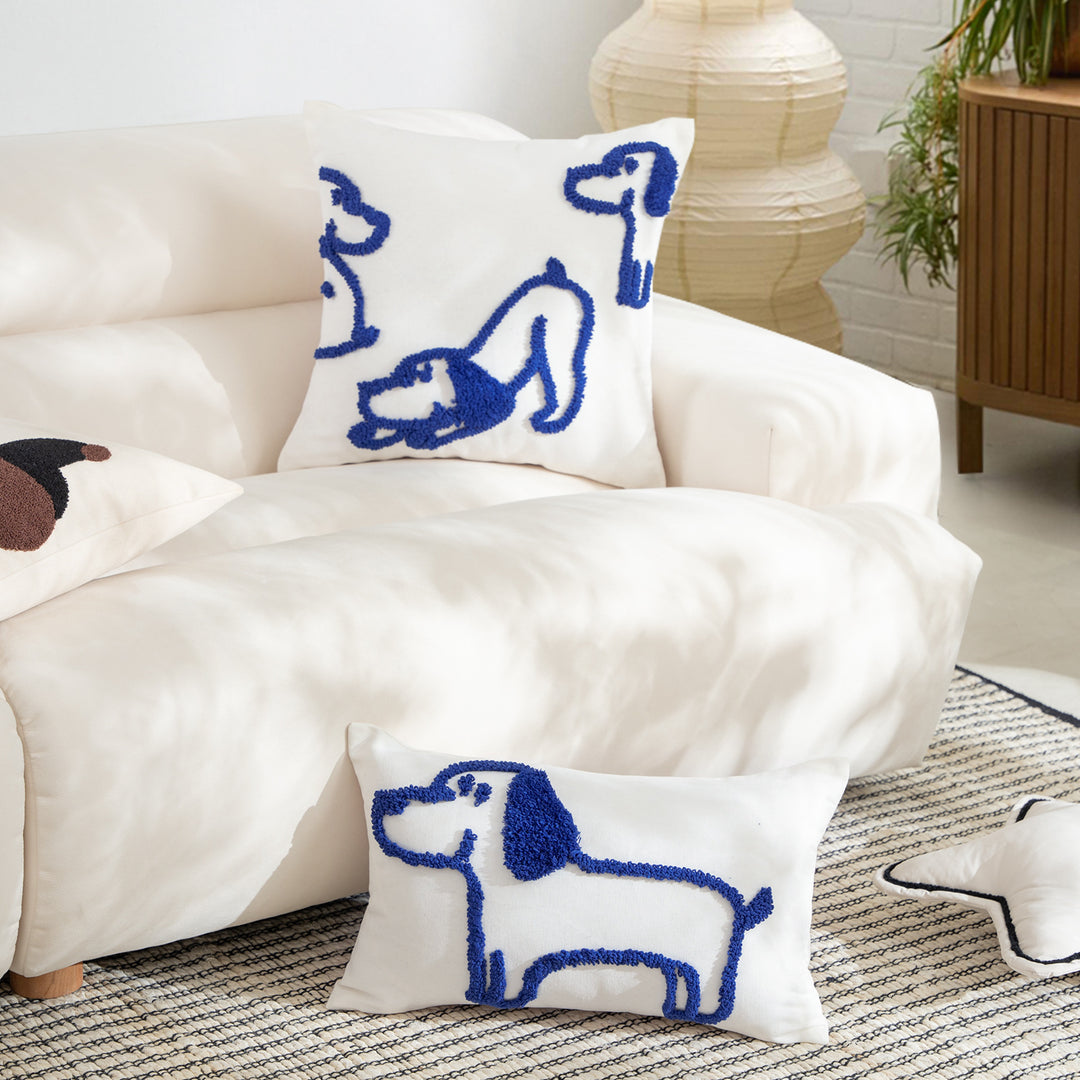 Rectangular decorative lumbar pillow with hand-tufted dog motif made of cotton blend
