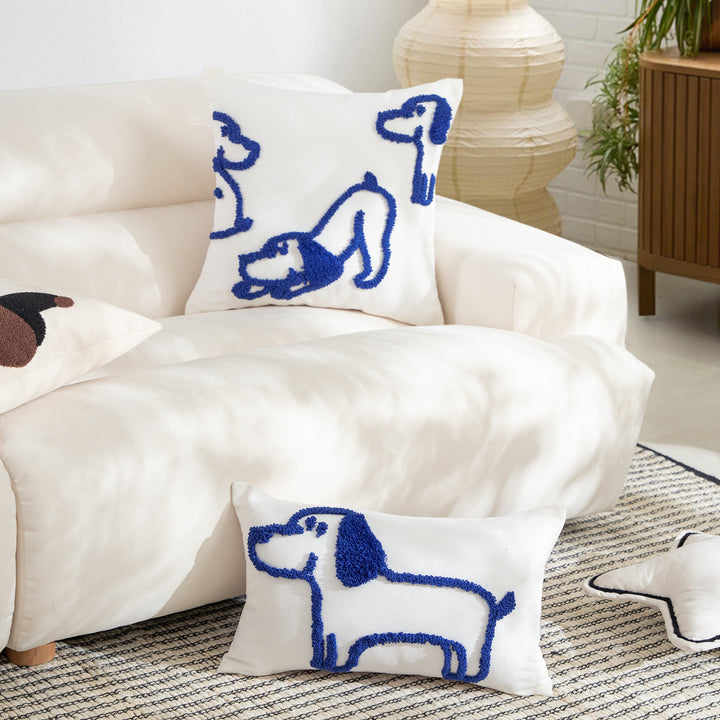 Rectangular decorative lumbar pillow with hand-tufted dog motif made of cotton blend