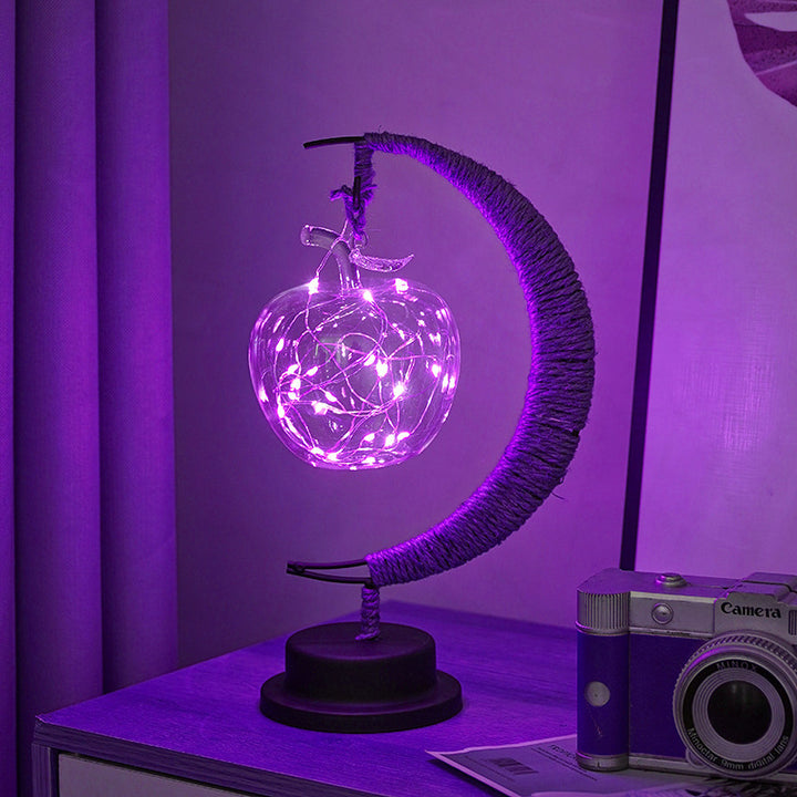 Decorative glass apple LED table lamp with moon-shaped rope-wrapped stand