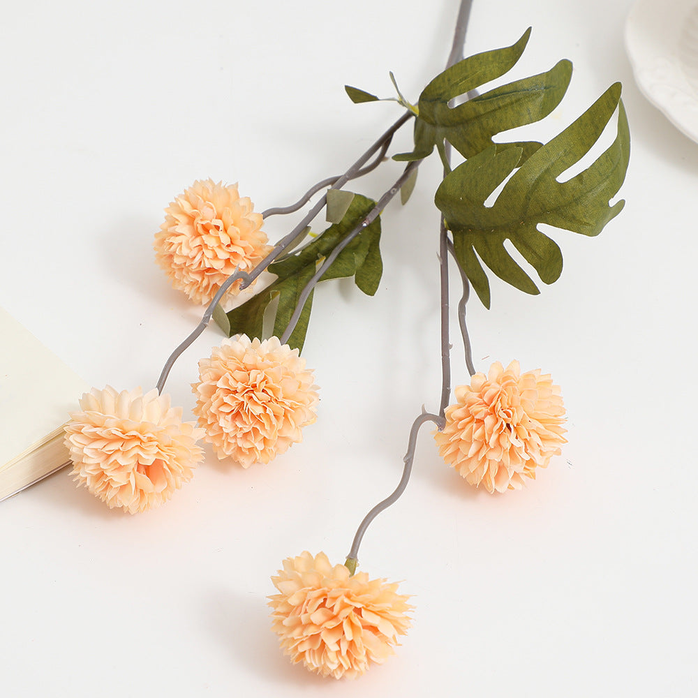 Artificial flower branch with intricate flowers