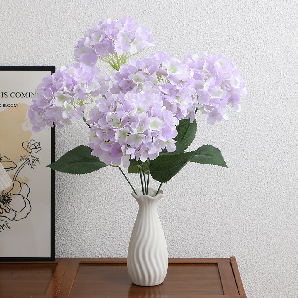 Decorative artificial flower arrangement