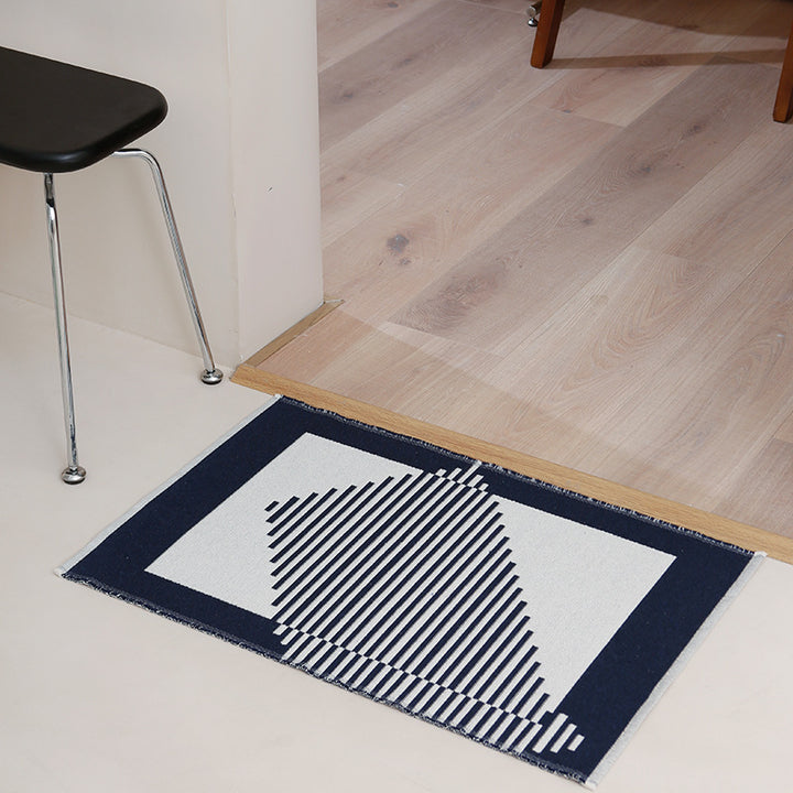 Modern geometric bathroom rug made of flat-woven cotton with non-slip backing
