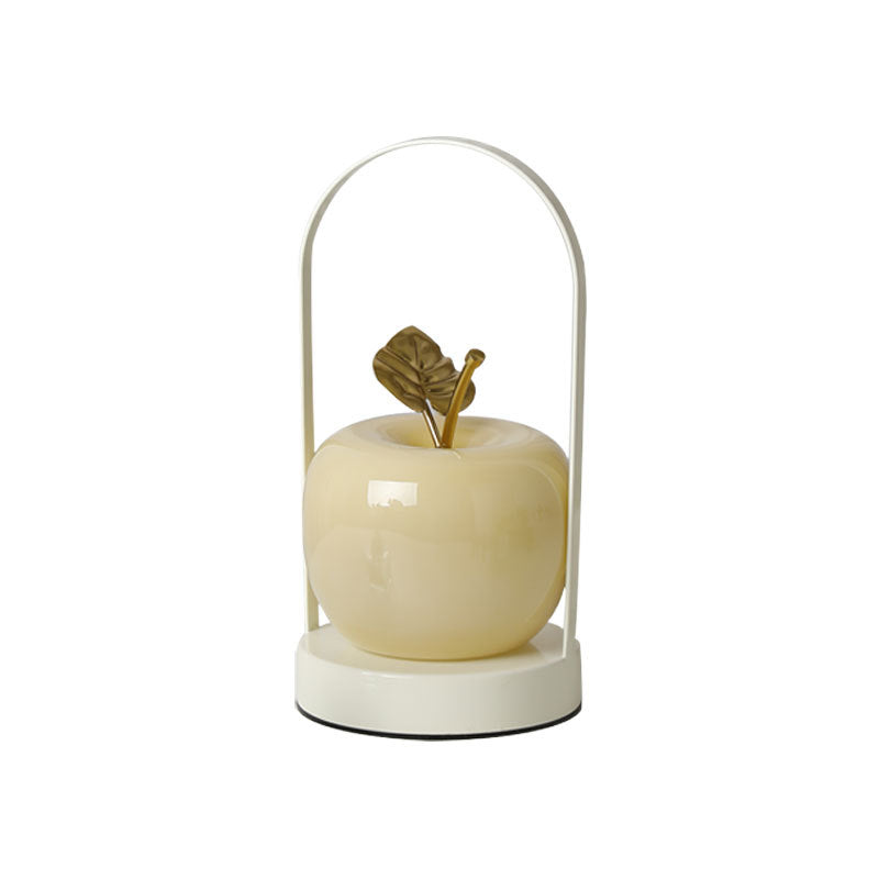 Ceramic apple-shaped ambient table lamp with brass handle