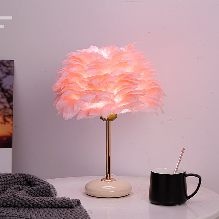 Feather shade table lamp with ceramic base and polished metal rod