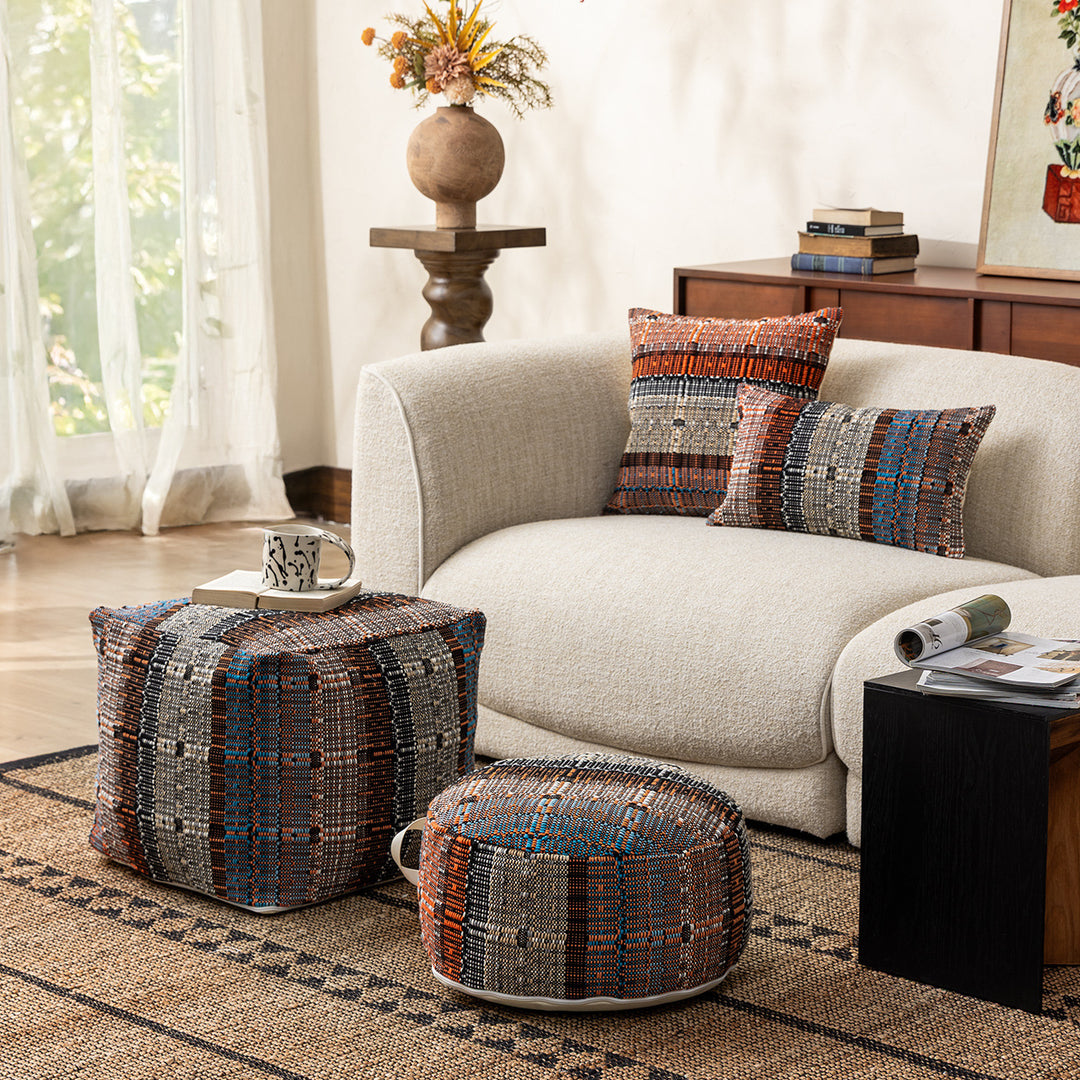Round woven seat pouf made of durable cotton mix with practical carrying handle