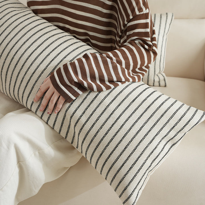 Long decorative lumbar roll made of textured linen fabric