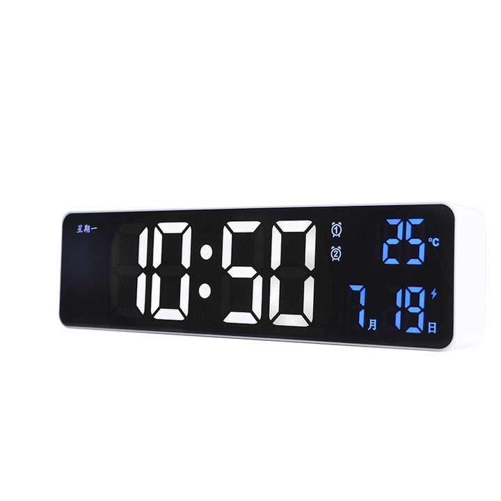 Digital alarm clock with temperature and date display