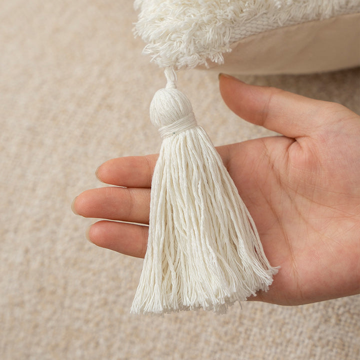 Square cushions with structured boucle look, quilted tufting and decorative tassels