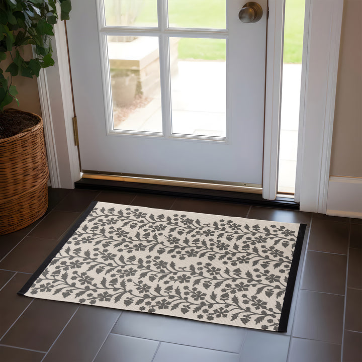 Woven table runner with floral vinyl print look and reinforced overlock stitching