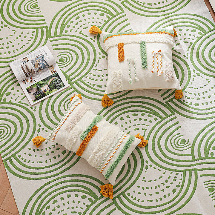 Decorative cotton cushion with hand-tufted relief and decorative tassels