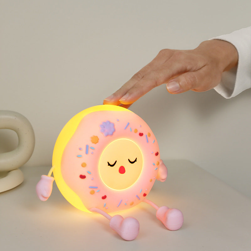 Whimsical silicone-shaped LED night light in donut form with flexible limbs
