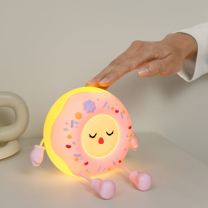 Whimsical silicone-shaped LED night light in donut form with flexible limbs