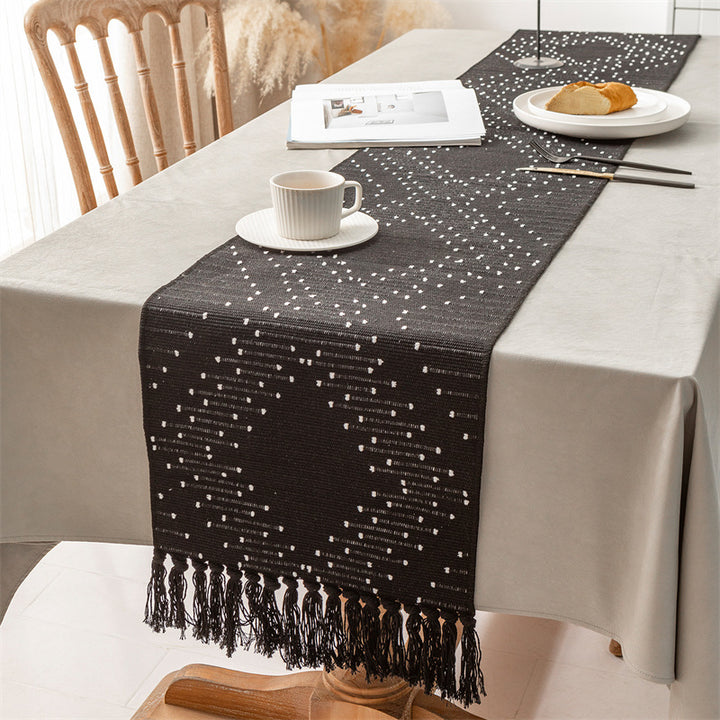 Handwoven table runner made of cotton blend with fringes and geometric dot jacquard