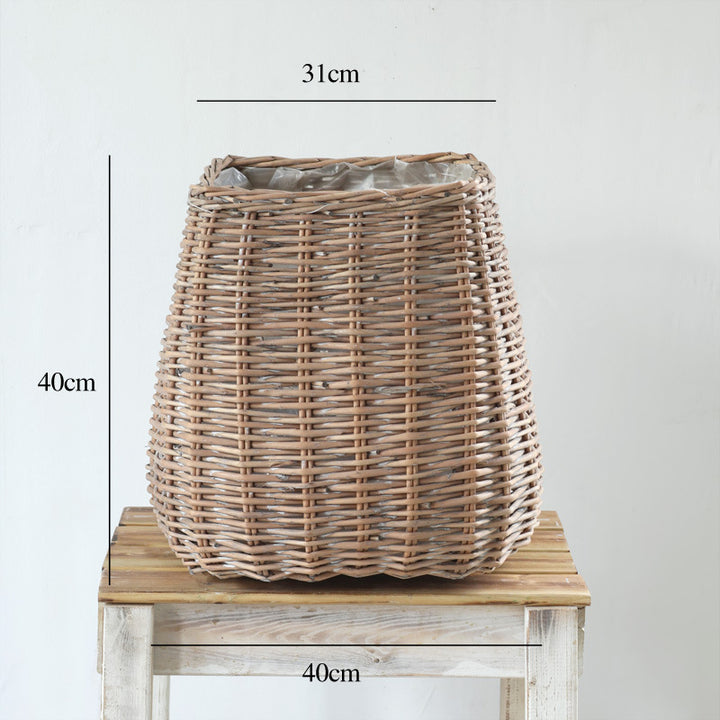 Stylish laundry basket made of braided natural material