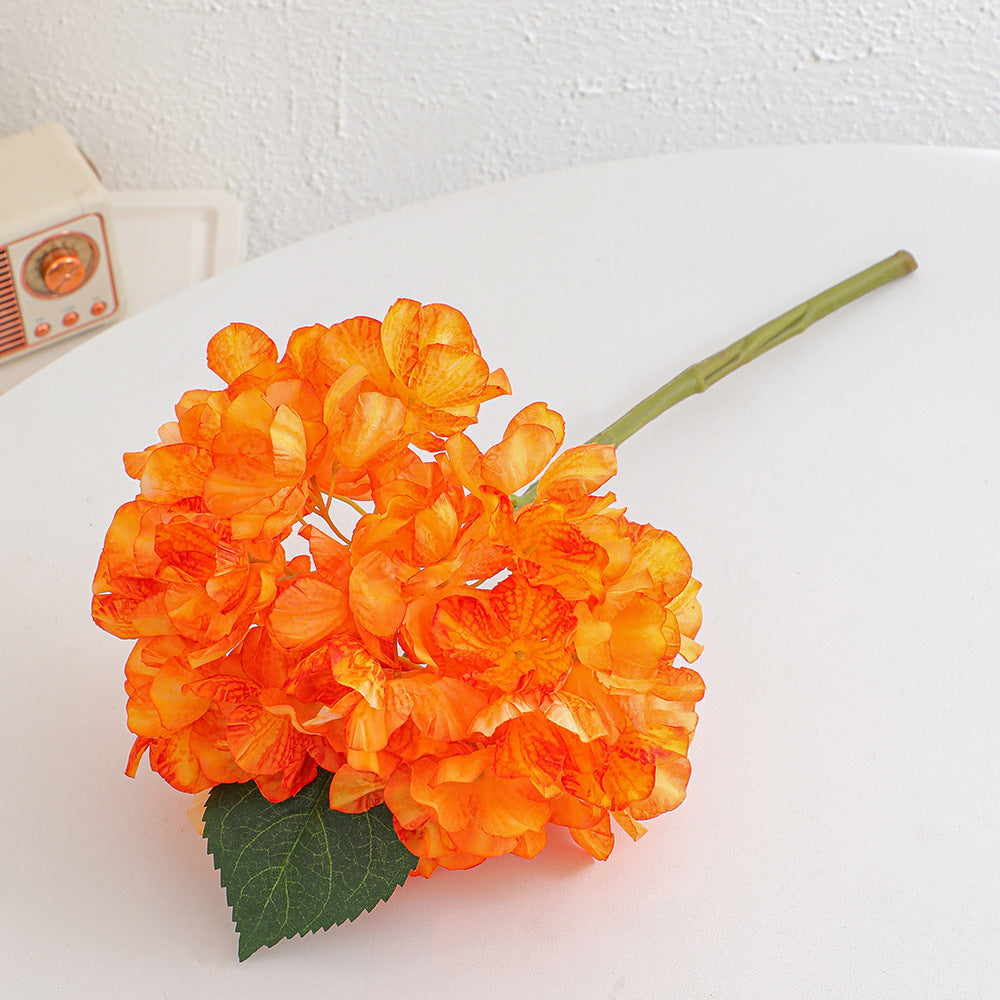 Artificial flower branch with realistic flowers