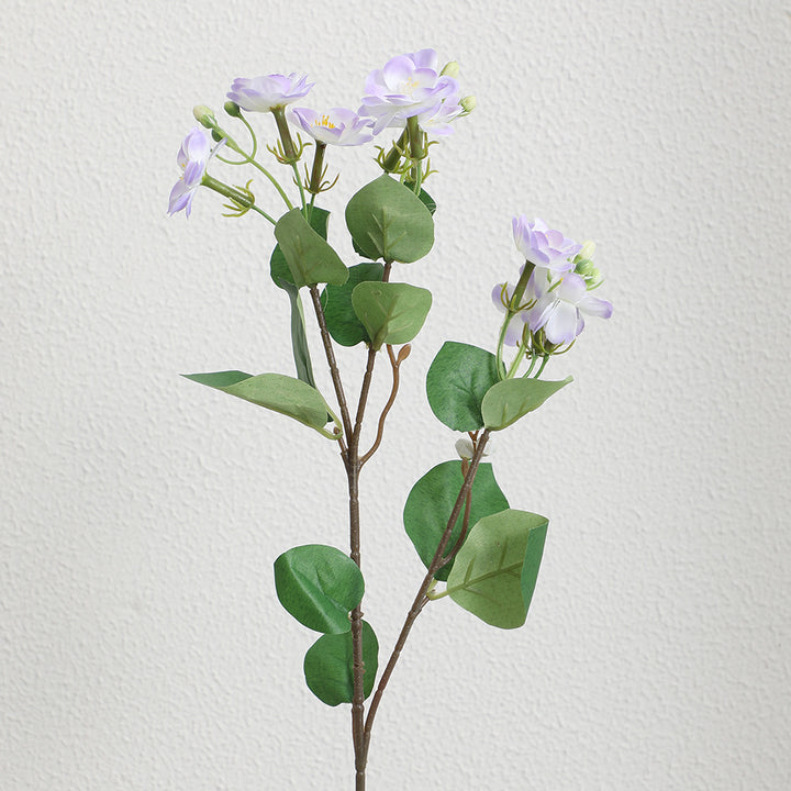 Artificial flower branch with vibrant pink flowers