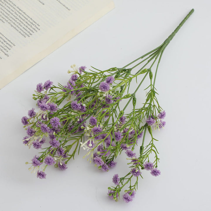 Decorative artificial flower branch with delicate purple flowers