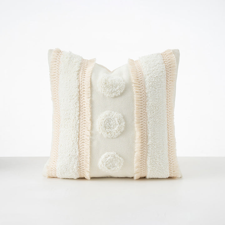 Square cushions with structured boucle look, quilted tufting and decorative tassels